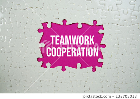 Jigsaw puzzle with a missing piece with "Teamwork Cooperation" on pink background Jigsaw puzzle with a missing piece with "Teamwork Cooperation" on pink background 138705018