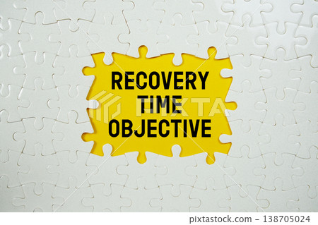 Jigsaw puzzle with a missing piece with "Recovery Time Objective" on yellow background 138705024