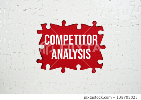 Jigsaw puzzle with a missing piece with "Competitor Analysis" on red background 138705025