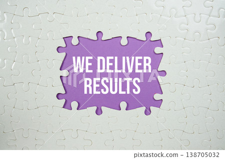 Jigsaw puzzle with a missing piece with "We Deliver Results" on purple background Jigsaw puzzle with a missing piece with "We Deliver Results" on purple background 138705032