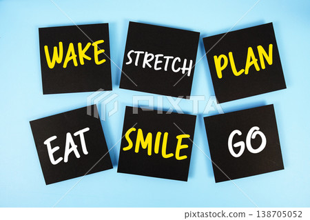 Wake, Stretch, Plan, Eat, Smile, Go message written on paper notes Morning Routine concept Wake, Stretch, Plan, Eat, Smile, Go message written on paper notes Morning Routine concept 138705052
