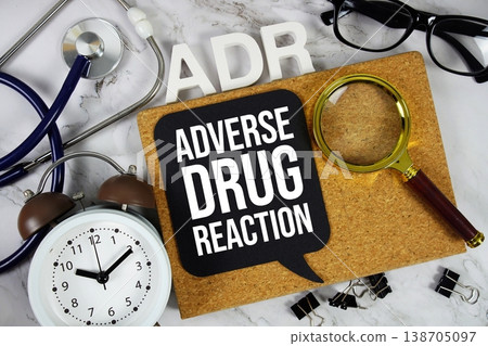 ADR Adverse Drug Reaction acronym with alarm clock and magnifying glass, medical and healthcare concept background ADR Adverse Drug Reaction acronym with alarm clock and magnifying glass, medical and healthcare concept background 138705097