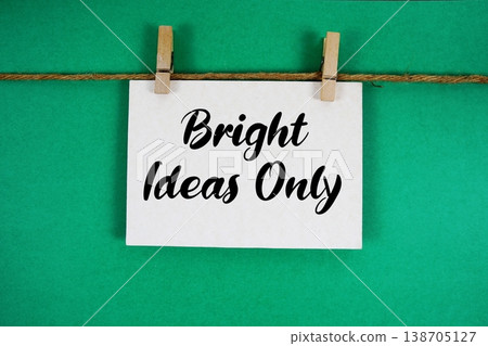 Bright Ideas Only text written on paper card with rope and wooden clip hanging Bright Ideas Only text written on paper card with rope and wooden clip hanging 138705127