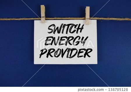 Switch Energy Provider text written on paper card with rope and wooden clip hanging 138705128