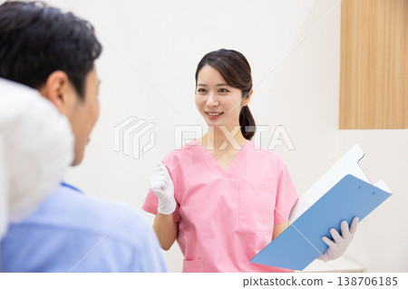 Dentist Dentist to examine 138706185