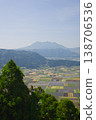 Rice fields and Mount Nekodake as seen from the Shiroyama Observatory in Aso. 138706536