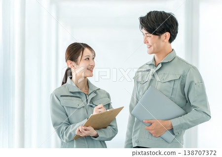 Male and female staff in manufacturing, construction, building, and transportation industries wearing work clothes. Male and female staff in manufacturing, construction, building, and transportation industries wearing work clothes. 138707372