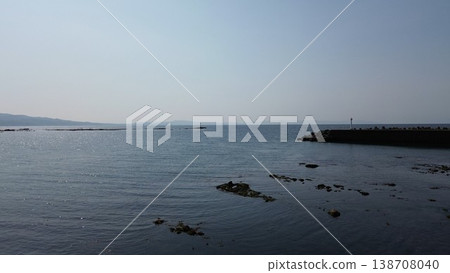 Drone aerial photography of the coastal scenery of the Sea of Japan and the mouth of the Sekinai River in Kumaishi, Yakumo Town, Hokkaido. 138708040