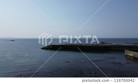 Drone aerial photography of the coastal scenery of the Sea of Japan and the mouth of the Sekinai River in Kumaishi, Yakumo Town, Hokkaido. 138708042