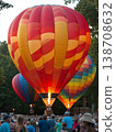 Colorful hot air balloons illuminate the night sky during a festival celebration 138708632