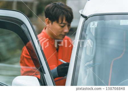 A light van and a man in overalls A light van and a man in overalls 138708848