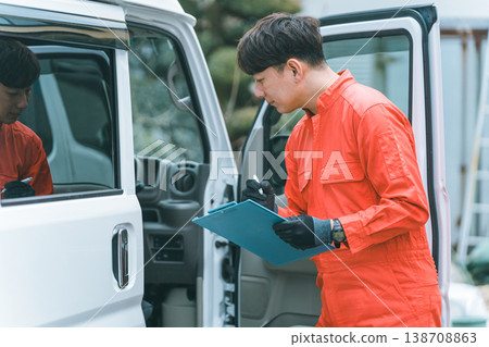 A light van and a man in overalls 138708863