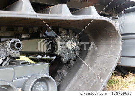 Driving wheel and inner teeth of harvester rubber track. 138709655