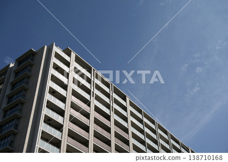 Apartment building against a blue sky Apartment building against a blue sky 138710168
