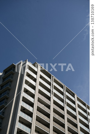 Apartment building against a blue sky 138710169