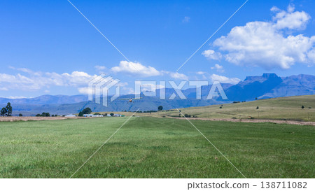 Flying Plane Grass Airstrip Plane Mountains Flying Plane Grass Airstrip Plane Mountains 138711082