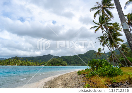 Coral garden beach with turquoise waters and palm trees on Huahine, French Polynesia Coral garden beach with turquoise waters and palm trees on Huahine, French Polynesia 138712226