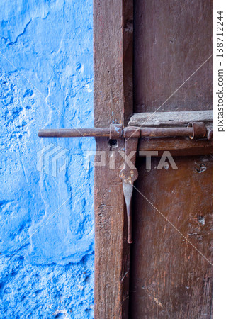 Wooden door close-up view with rusty 138712244