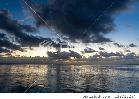 Golden sunset over the ocean in Tikehau, French Polynesia Golden sunset over the ocean in Tikehau, French Polynesia 138712254