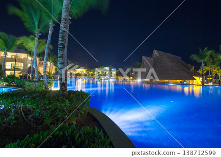 Swimming pool at a luxury Caribbean, tropical resort at night Swimming pool at a luxury Caribbean, tropical resort at night 138712599
