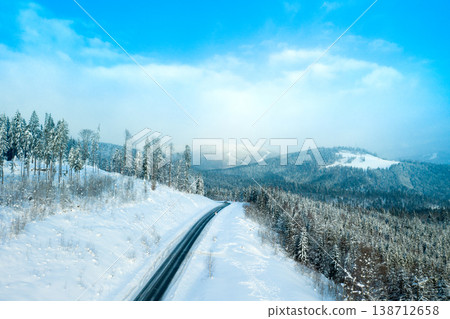 beautiful winter forest and the road beautiful winter forest and the road 138712658