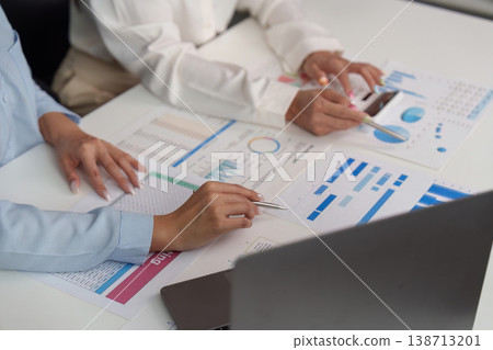 Close-up of professionals analyzing financial charts Close-up of professionals analyzing financial charts 138713201