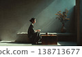 Lonely Man Sitting in Dark Room with Dramatic Lighting 138713677