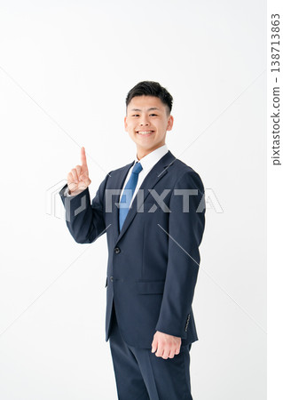 Young male business pointing Young male business pointing 138713863