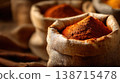 Spices in sacks on a wooden table 138715478