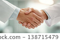 Office handshake between two 138715479