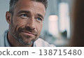 Man smiles while listening 138715480