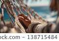 Lady lounges on a hammock 138715484