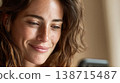 Woman looking at phone indoors 138715487