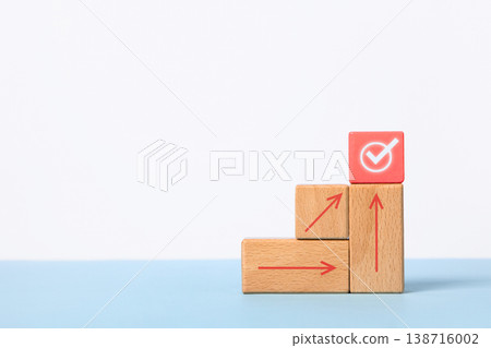 Business growth success achievement concept. Wooden blocks in form of graphical steps up and arrows of business growth process, sustainable financial plan. Action plan, profit, economic concepts 138716002