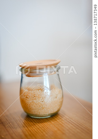 Brown sugar and a jar placed on the cafe table Brown sugar and a jar placed on the cafe table 138717349