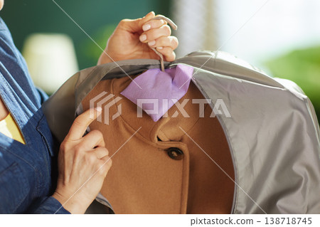 Adding Lavender Sachet to Winter Coat in Garment Bag 138718745