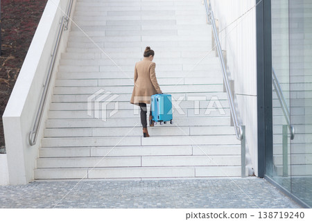Modern Traveler Navigating Railway Station Stairs 138719240