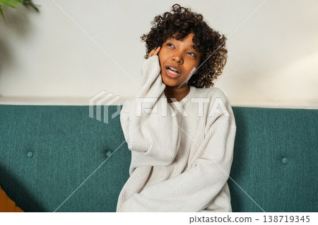 Beautiful African American girl with afro hairstyle smiling. Close up portrait of young happy black girl. Young African woman with curly hair laughing. Freedom happiness carefree happy people concept Beautiful African American girl with afro hairstyle smiling. Close up portrait of young happy black girl. Young African woman with curly hair laughing. Freedom happiness carefree happy people concept 138719345