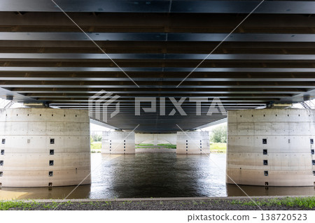 Massive canal bridge Magdeburg waterway river powerful steel beam concrete pillars dramatic symmetrical perspective. Industrial engineering landmark water reflections transport infrastructure Massive canal bridge Magdeburg waterway river powerful steel beam concrete pillars dramatic symmetrical perspective. Industrial engineering landmark water reflections transport infrastructure 138720523