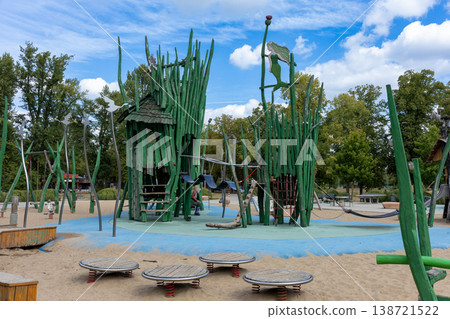 Fantasy Themed Wooden Playground Tower With Climbing Net And Slide In City Park 138721522