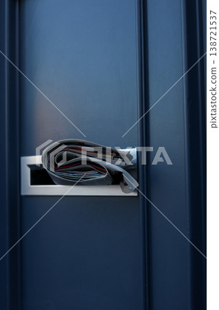 Folded Newspaper Inside Modern Metal Mailbox Representing News Delivery And Communication Folded Newspaper Inside Modern Metal Mailbox Representing News Delivery And Communication 138721537