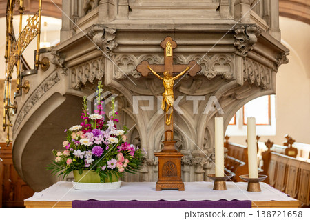 Christian Church Altar with Crucifix Flowers and Candles 138721658