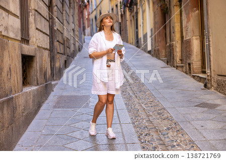 Female Traveler Exploring Old City Street With Map 138721769