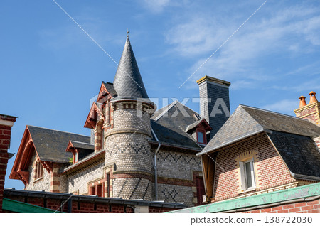 Historic stone house with turret in Normandy France traditional architecture under blue sky 138722030