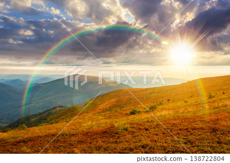 sunset over nature scenery with alpine meadow. carpathian mountain landscape during summertime. stunning view of rolling hills. cloudy sky with rainbow. highland background for freedom concept sunset over nature scenery with alpine meadow. carpathian mountain landscape during summertime. stunning view of rolling hills. cloudy sky with rainbow. highland background for freedom concept 138722804
