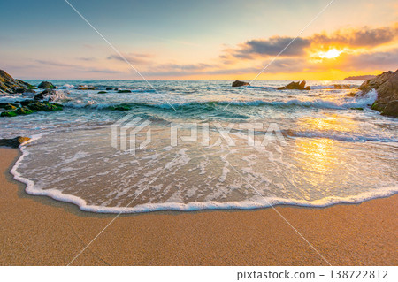 sandy beach of a black sea at sunrise. bulgaria scene on hot summer vacation season. beautiful view of waves washing the sand in morning light. generic image of seascape and sky for background 138722812