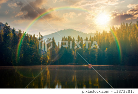 quiet sunset over lake. coniferous forest reflecting on the calm body of water. exquisite place in national park in evening light under rainbow. summer nature background image for nostalgia concept 138722813