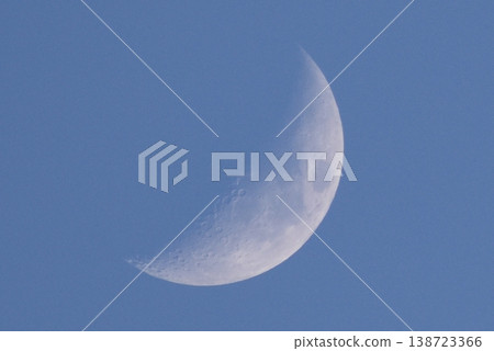 A white moon floating in the blue sky A white moon floating in the blue sky 138723366