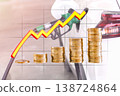 Pile of golden coins and rising graph line over car fueling at gas station 138724864