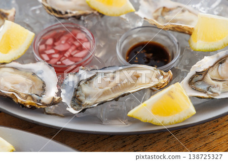 Fresh oysters on ice with champagne Fresh oysters on ice with champagne 138725327